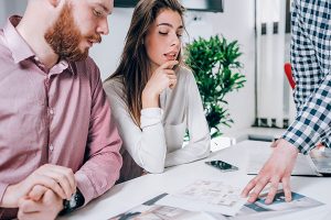 couple looking at a real estate contract and mortgage details